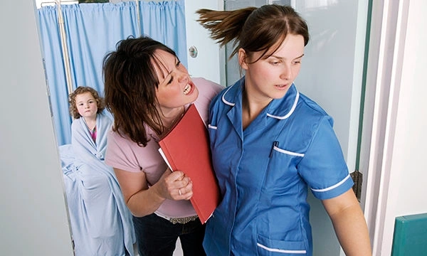 A nurse experiencing verbal aggression in a healthcare setting